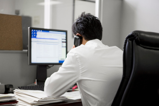 man in office on the telephone